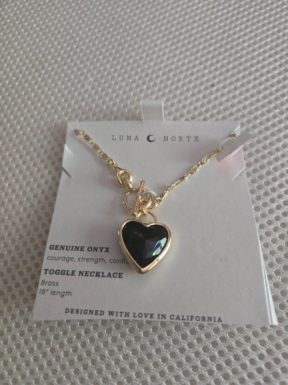 Luna Norte black onyx heart on brass necklace 18" long, front toggle